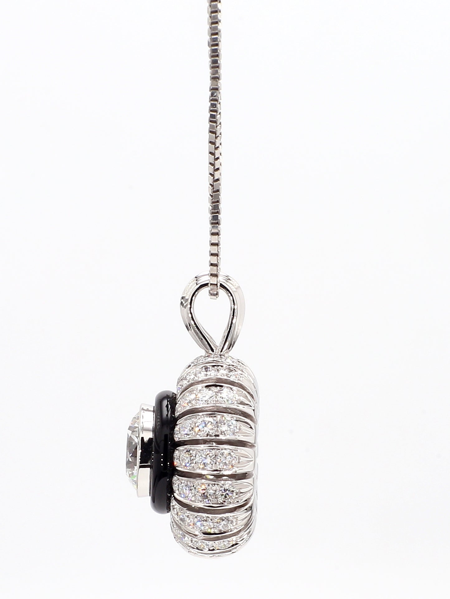 TORUS NECKLACE 2.53 CARAT TOTAL WEIGHT, TRIPLE EXCELLENT ROUND BRILLIANT, 1.26 E VVS1, GIA #2151110355, 1.27 MELEE, BLACK ONYX, 18K WHITE GOLD