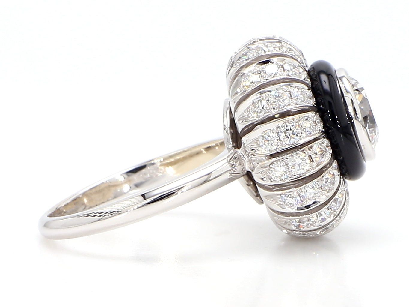 TORUS RING 2.47 CARAT TOTAL WEIGHT, TRIPLE EXCELLENT ROUND BRILLIANT 1.21 BR F VS1, GIA #3255695972, 1.26 MELEE, BLACK ONYX, 18K WHITE GOLD